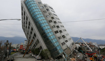 Rescuers scour tilting buildings after Taiwan quake kills seven