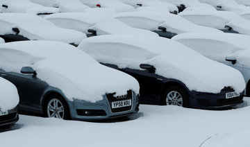 Snow and wind paralyze European airports, trap drivers