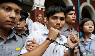 Myanmar court charges Reuters reporters under Official Secrets Act