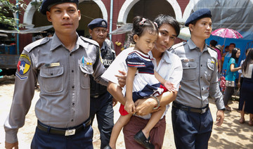 Reuters reporter says Myanmar police planted “secret” papers