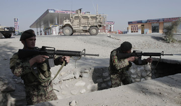 Officials: Afghan forces push back Taliban from key city