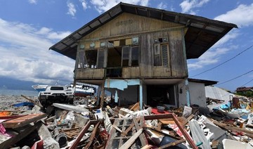 Indonesia ends grim search for dead in quake-tsunami