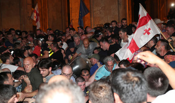 Thousands of protesters try to storm Georgia parliament