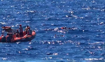 Desperate migrants jump off rescue ship, seeking Italy