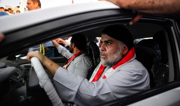 Cleric Al-Sadr urges rivals to help oust Iraq's prime minister