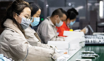 One worker at a time, virus-hit China’s factories sputter back online