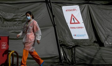 Spain sees daily drop in virus deaths, over 15,000 total