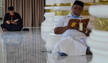 In Aceh, Indonesians pray at mosque during COVID-19 Ramadan, but bring own rugs