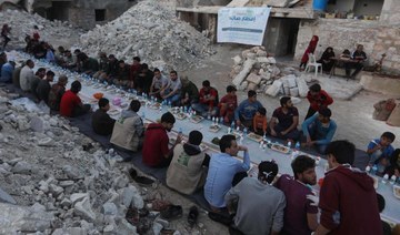 Amid ruins of a Syrian town, Ramadan meal reunites a community