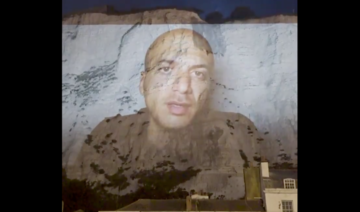 Syrian filmmaker recalls ‘terrifying’ journey to UK in projection on Dover cliffs