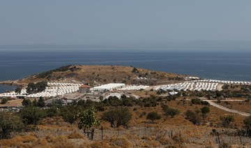 Greek police move homeless migrants to new Lesbos camp