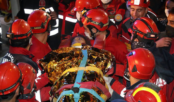 Rescuers weep with joy as Turkey pulls 2 girls from rubble