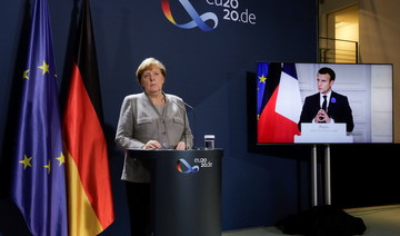 Macron says terrorism threat needs quick European answer, Merkel urges Schengen border reform