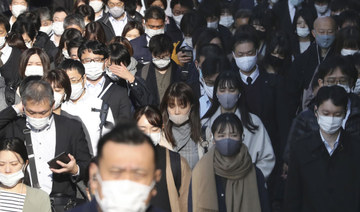 Japan’s capital raises coronavirus alert to highest as cases set record