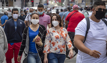 Moroccans wearing face masks wafter the authorities eased lockdown measures in some cities, on June 25, 2020. (AFP/File Photo)