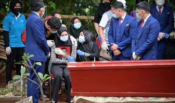 Sobbing relatives bury Indonesian plane crash victim