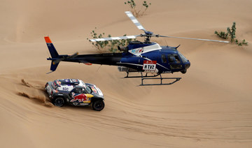 X-Raid Mini JCW Team’s Stephane Peterhansel and Co-Driver Edouard Boulanger in action during stage 11 of the Dakar Rally. (Reuters)