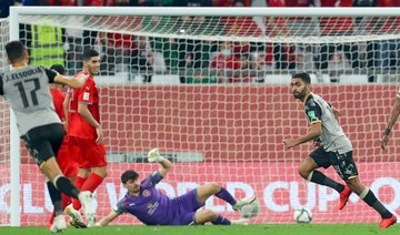 Al-Ahly's midfielder Hussein El-Shahat (R) runs after scoring during the FIFA Club World Cup second round match between Qatar's Al-Duhail and Egypt's Al-Ahly at the Education City Stadium in the Qatari city of Ar-Rayyan on February 4, 2021. (AFP)