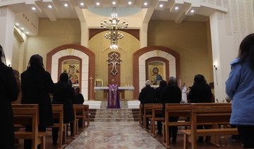 Nashwan Hanna gives a sermon at Mar Elia Chaldean Catholic Church in the Christian-majority neighborhood of Ankawa, Erbil. (Kareem Botane)