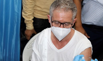 Philippe Duamelle, UNICEF’s representative in Yemen, receives the AstraZeneca COVID-19 vaccine at a medical center in Aden, Yemen April 20, 2021. (Reuters)