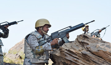  Saudi border guards keep watch along the border with Yemen in the al-Khobh area in the southern Jizan province. (AFP file photo)