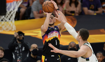 Phoenix Suns guard Devin Booker shoots against Milwaukee Bucks center Brook Lopez during Game 2 of the 2021 NBA Finals at Phoenix Suns Arena. (Joe Camporeale-USA TODAY Sports)