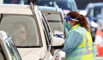 A medical worker prepares to administer a test at the Bondi Beach drive-through coronavirus disease (COVID-19) testing centre in the wake of new positive cases in Sydney, Australia. (REUTERS file photo)