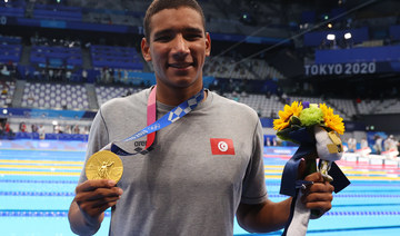 Gold medalist Ahmed Hafnaoui of Tunisia on the podium.(REUTERS/Kai Pfaffenbach)