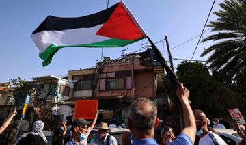 Palestinian and Israeli activists demonstrate against the expulsion of Palestinian families from their homes, in the Palestinian neighbourhood of Sheikh Jarrah in Israeli-annexed east Jerusalem. (AFP/File Photo)