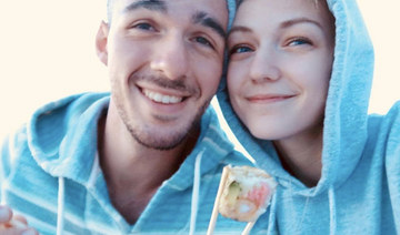 Gabrielle Petito, 22, who was reported missing on Sept. 11, 2021 after traveling with her boyfriend around the country in a van and never returned home, poses for a photo with Brian Laundrie in this undated handout photo. (REUTERS)