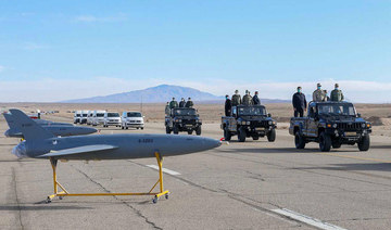 A handout photo made available by the Iranian Army office on January 5, 2021, shows military officials inspecting drones on display prior to a military drone drill at an undisclosed location in central Iran. (AFP/Iranian Army Office/File Photo)