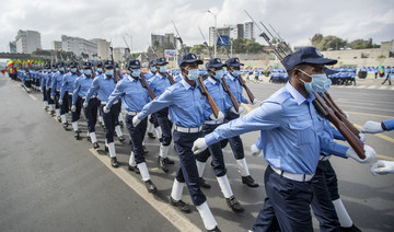 Ethiopian police march during a parade to display new police uniforms and instruct them to maintain impartiality and respect the law during the election, in Meskel Square in downtown Addis Ababa, Ethiopia on June 19, 2021. (AP)