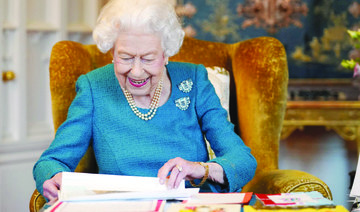 Britain’s Queen Elizabeth views a display of memorabilia from her Golden and Platinum Jubilees in the Oak Room at Windsor Castle, Windsor, Britain. (Reuters)
