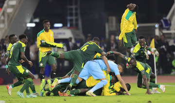 Senegal's Sadio Mane celebrates with teammates after beating Egypt in the AFCON 2021 final match on Feb. 6, 2022. (REUTERS/Thaier Al-Sudani