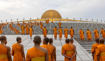 Thai Buddhists mark holy day in subdued celebrations