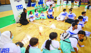  The students and the wrestlers coming together for activities in the anti-bullying campaign, ‘Be A Star,’ at King Abdullah Sports City Stadium. (Supplied)