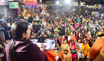 Supporters of the Bharatiya Janata Party listen to their leader and union minister Smriti Irani during an election campaign rally in Allahabad, ahead of Uttar Pradesh state assembly elections. (AFP)