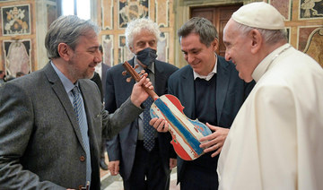 Pope blesses violin made from Mediterranean migrant boat