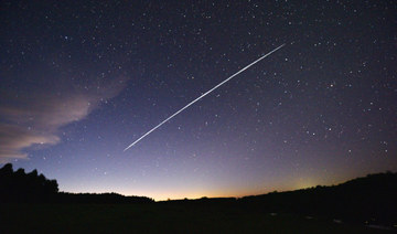 This long-exposure image shows a trail of a group of SpaceX's Starlink satellites passing over Uruguay as seen from the countryside some 185 km north of Montevideo, Florida Department. (AFP file photo)