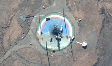 In this satellite photo from Maxar Technologies, trucks and other equipment surround a scorched launch pad at Iran's Imam Khomeini Spaceport in rural Semnan province Sunday, Feb. 27, 2022. (AP)