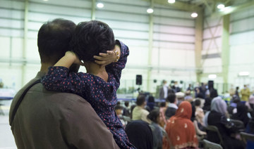 People who fled Afghanistan waiting for another flight at the air base of Al Dhafra, near Abu Dhabi as part of the operation "Apagan". (AFP file photo)