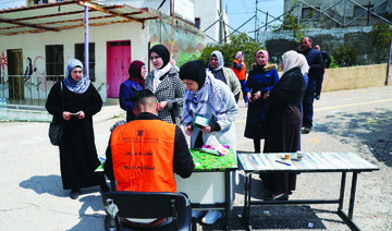 Polls opened in the Israeli-occupied West Bank on Saturday in a rare democratic exercise following a decade and a half of delays to Palestinian elections. (AFP)