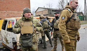 Kyiv's Mayor Vitali Klitschko (R) talks with people in the town of Bucha, near the Ukrainian capital Kyiv on April 3, 2022. (AP)