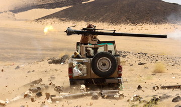 A Yemeni government fighter fires a vehicle-mounted weapon at Houthi positions, Marib, Yemen, Mar. 9, 2021. (Reuters/File Photo)