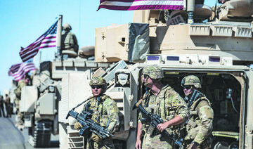 American forces patrol near the countryside of Rumaylan in Syria’s northeastern Hasakeh province near the border with Turkey. 