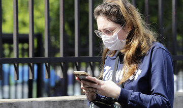 A Lebanese woman checks her phone in the capital Beirut. (AFP file photo)