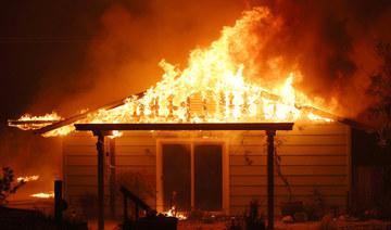 A home burns as the Oak Fire moves through the area on July 23, 2022 near Mariposa, California. (AFP)