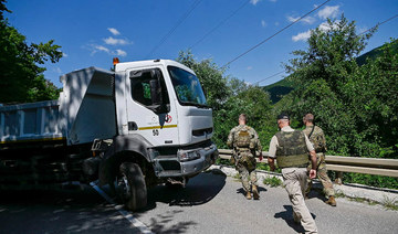 NATO peacekeepers oversee removal of roadblocks in Kosovo