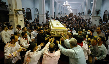 Egyptians mourn 41 killed in Cairo Coptic church fire