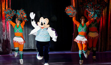 A Performer dressed as Walt Disney's animated cartoon character Mickey Mouse, performs during Disney On Ice festival in Riyadh